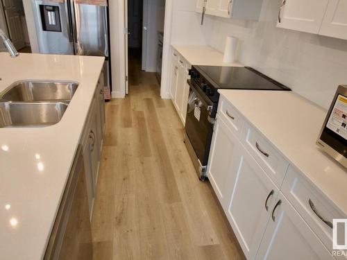 Upper 8866 Carson Way, Edmonton, AB - Indoor Photo Showing Kitchen With Double Sink