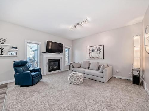 154 Spruce Gardens Crescent, Spruce Grove, AB - Indoor Photo Showing Living Room With Fireplace