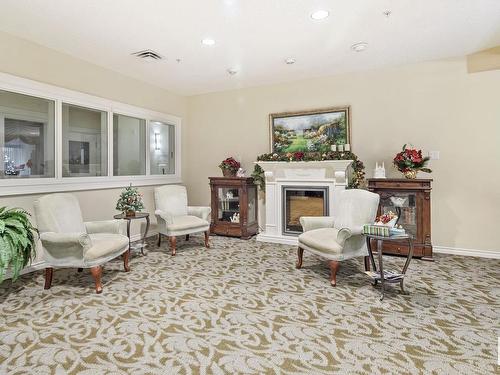 315 9820 165 Street, Edmonton, AB - Indoor Photo Showing Living Room With Fireplace