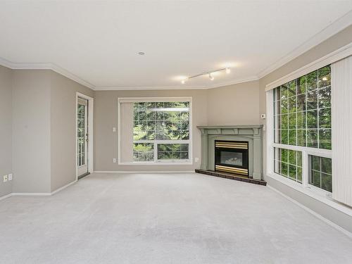 202 20 St Joseph Street, St. Albert, AB - Indoor Photo Showing Living Room With Fireplace