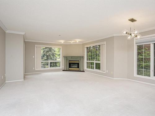 202 20 St Joseph Street, St. Albert, AB - Indoor Photo Showing Living Room With Fireplace