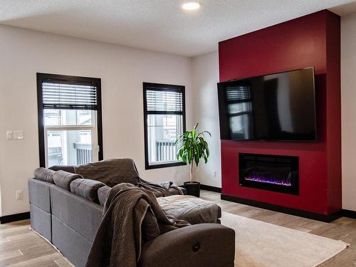 6621 47 Avenue, Beaumont, AB - Indoor Photo Showing Living Room With Fireplace