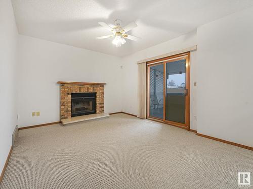 7223 152B Avenue, Edmonton, AB - Indoor Photo Showing Living Room With Fireplace