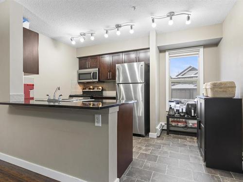 125 5816 Mullen Place, Edmonton, AB - Indoor Photo Showing Kitchen With Stainless Steel Kitchen