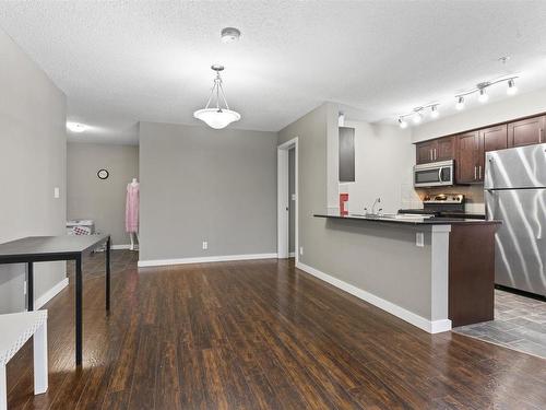 125 5816 Mullen Place, Edmonton, AB - Indoor Photo Showing Kitchen With Stainless Steel Kitchen