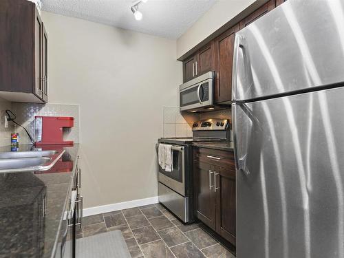 125 5816 Mullen Place, Edmonton, AB - Indoor Photo Showing Kitchen With Stainless Steel Kitchen