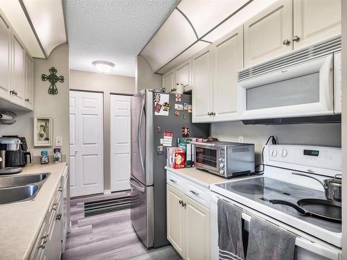 234 4210 139 Avenue, Edmonton, AB - Indoor Photo Showing Kitchen With Double Sink