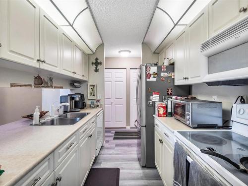 234 4210 139 Avenue, Edmonton, AB - Indoor Photo Showing Kitchen With Double Sink