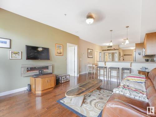 307 10808 71 Avenue, Edmonton, AB - Indoor Photo Showing Living Room With Fireplace