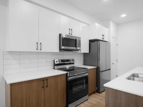 301 9227 228 Street, Edmonton, AB - Indoor Photo Showing Kitchen With Stainless Steel Kitchen With Double Sink