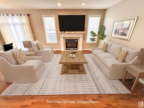 1 1251 Rutherford Road, Edmonton, AB - Indoor Photo Showing Living Room With Fireplace