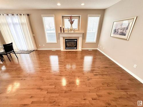 1 1251 Rutherford Road, Edmonton, AB - Indoor Photo Showing Living Room With Fireplace