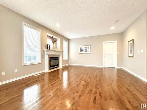 1 1251 Rutherford Road, Edmonton, AB - Indoor Photo Showing Living Room With Fireplace