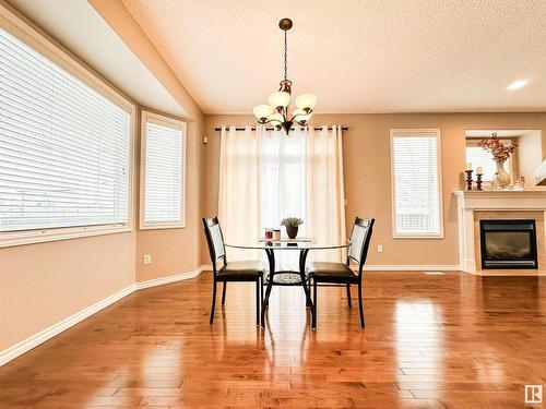 1 1251 Rutherford Road, Edmonton, AB - Indoor Photo Showing Dining Room With Fireplace