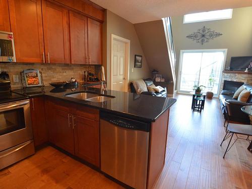 619 10235 112 Street, Edmonton, AB - Indoor Photo Showing Kitchen With Fireplace With Double Sink