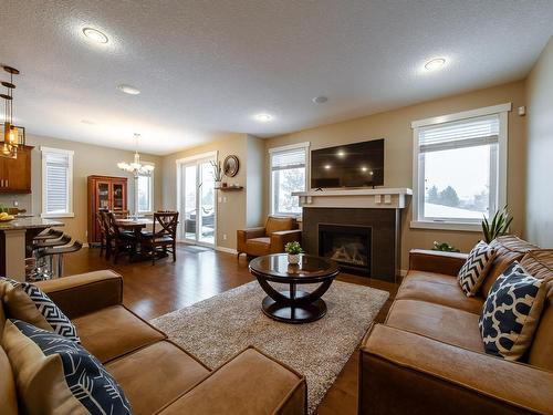 93 Sheppard Way, Leduc, AB - Indoor Photo Showing Living Room With Fireplace