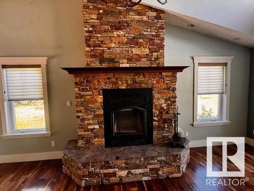 630049 Range Road 55, Rural Woodlands County, AB - Indoor Photo Showing Living Room With Fireplace