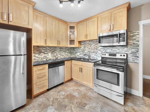 10930 65 Avenue, Edmonton, AB - Indoor Photo Showing Kitchen With Double Sink With Upgraded Kitchen