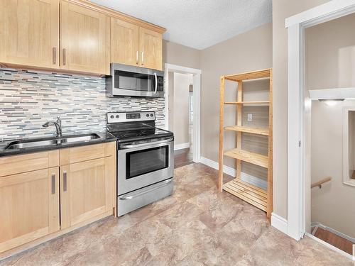 10930 65 Avenue, Edmonton, AB - Indoor Photo Showing Kitchen With Double Sink