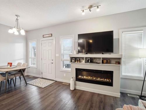 7173 Cardinal Way, Edmonton, AB - Indoor Photo Showing Living Room With Fireplace