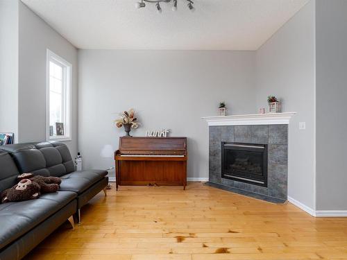 8732 10 Avenue, Edmonton, AB - Indoor Photo Showing Living Room With Fireplace