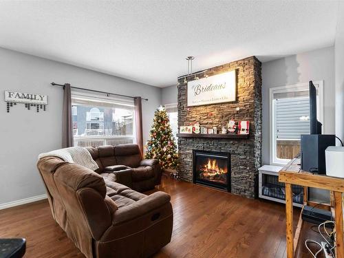 79 Avonlea Way, Spruce Grove, AB - Indoor Photo Showing Living Room With Fireplace