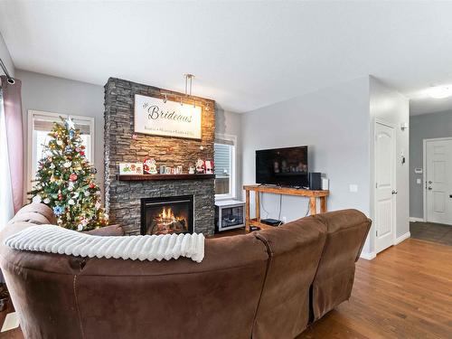 79 Avonlea Way, Spruce Grove, AB - Indoor Photo Showing Living Room With Fireplace