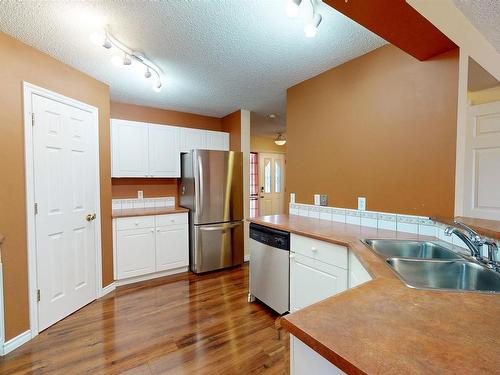 3553 23 St, Edmonton, AB - Indoor Photo Showing Kitchen With Double Sink