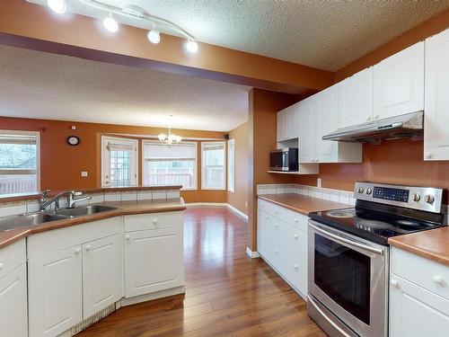 3553 23 St, Edmonton, AB - Indoor Photo Showing Kitchen With Double Sink