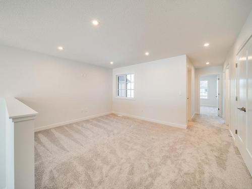 77 Chelles Wynd, St. Albert, AB - Indoor Photo Showing Other Room With Fireplace