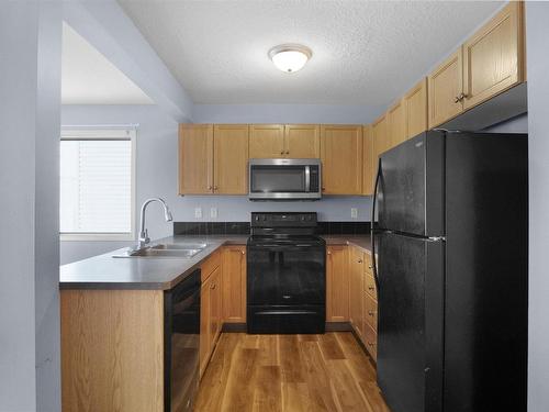 188 230 Edwards Drive Sw, Edmonton, AB - Indoor Photo Showing Kitchen With Double Sink