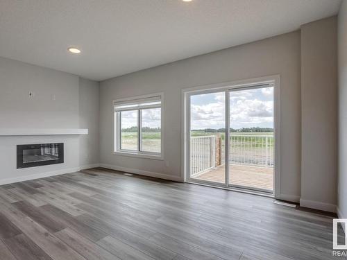 1068 Berg Place, Leduc, AB - Indoor Photo Showing Living Room With Fireplace