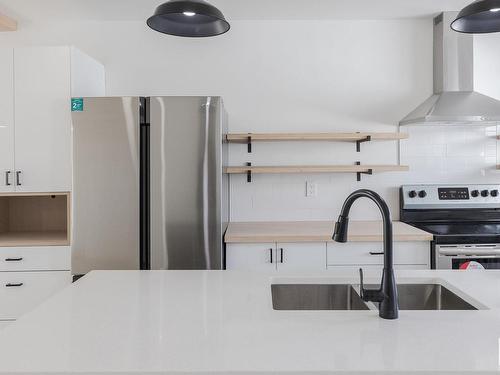 9604/9606 124 Avenue, Edmonton, AB - Indoor Photo Showing Kitchen With Double Sink