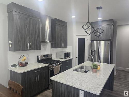 8131 Orchards Green, Edmonton, AB - Indoor Photo Showing Kitchen With Double Sink With Upgraded Kitchen