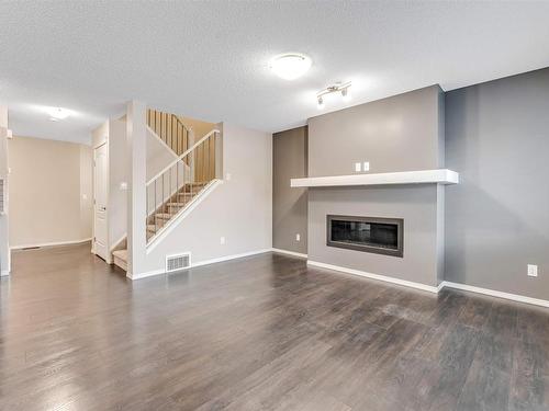 1963 51 Street, Edmonton, AB - Indoor Photo Showing Living Room With Fireplace