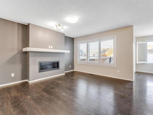 1963 51 Street, Edmonton, AB - Indoor Photo Showing Living Room With Fireplace