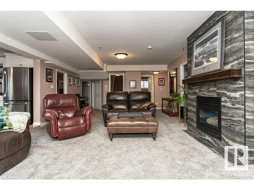 19 Frederick Boulevard, Rural Parkland County, AB - Indoor Photo Showing Living Room With Fireplace