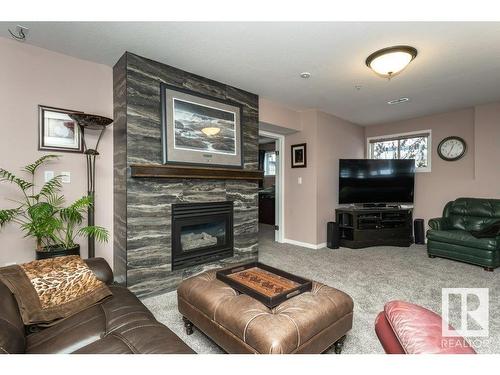 19 Frederick Boulevard, Rural Parkland County, AB - Indoor Photo Showing Living Room With Fireplace