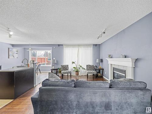 1151 Rutherford Close, Edmonton, AB - Indoor Photo Showing Living Room With Fireplace