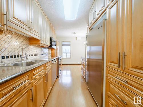 204 4812 51 Avenue, Stony Plain, AB - Indoor Photo Showing Kitchen With Stainless Steel Kitchen With Double Sink