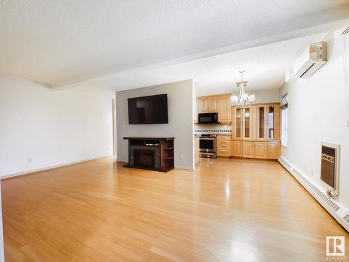 204 4812 51 Avenue, Stony Plain, AB - Indoor Photo Showing Living Room With Fireplace