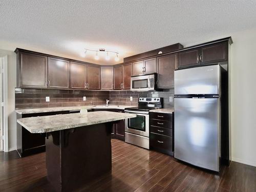 407 6070 Schonsee Way, Edmonton, AB - Indoor Photo Showing Kitchen With Stainless Steel Kitchen With Upgraded Kitchen