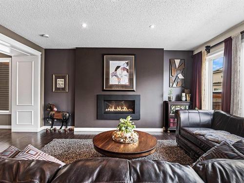 149 Sandalwood Crescent, Sherwood Park, AB - Indoor Photo Showing Living Room With Fireplace