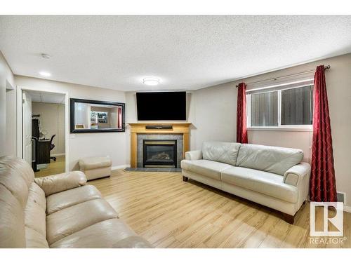 174 Ward Crescent, Edmonton, AB - Indoor Photo Showing Living Room With Fireplace