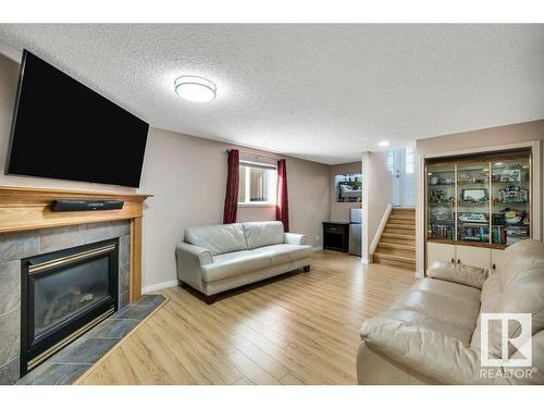 174 Ward Crescent, Edmonton, AB - Indoor Photo Showing Living Room With Fireplace