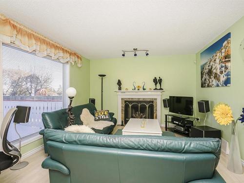 8904 170A Avenue, Edmonton, AB - Indoor Photo Showing Living Room With Fireplace