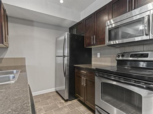 112 534 Watt Blvd Sw, Edmonton, AB - Indoor Photo Showing Kitchen With Double Sink