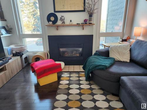 20 1440 Sherwood Drive, Sherwood Park, AB - Indoor Photo Showing Living Room With Fireplace