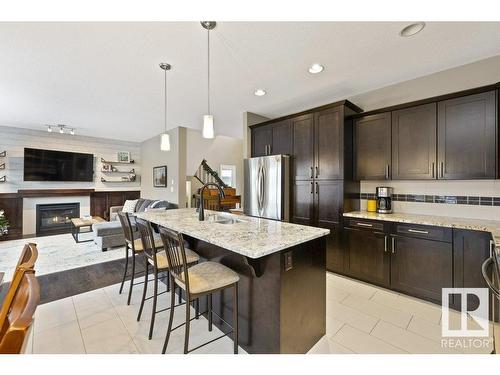 48 Newgate Way, St. Albert, AB - Indoor Photo Showing Kitchen With Fireplace With Upgraded Kitchen