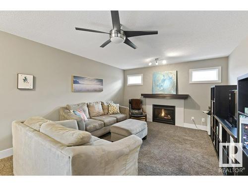 48 Newgate Way, St. Albert, AB - Indoor Photo Showing Living Room With Fireplace